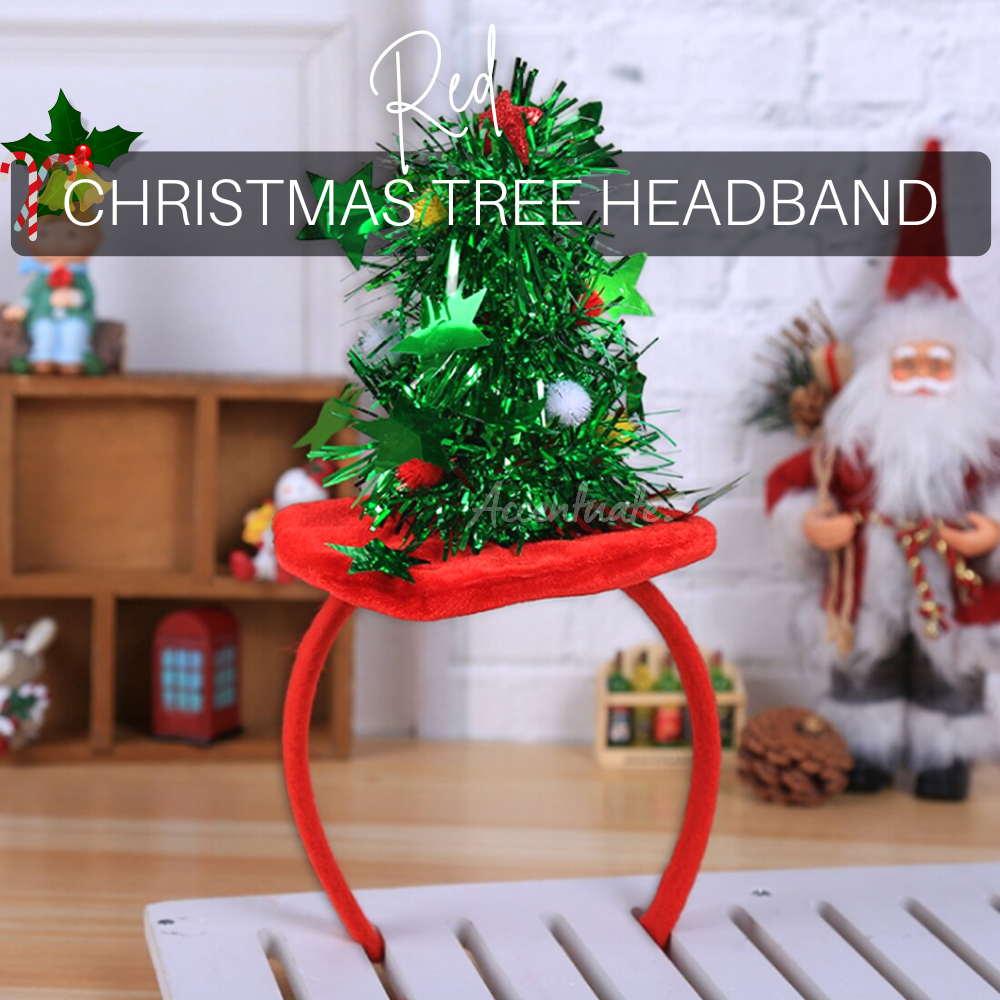 Christmas tree headband with green tinsel and red accents on a white surface.